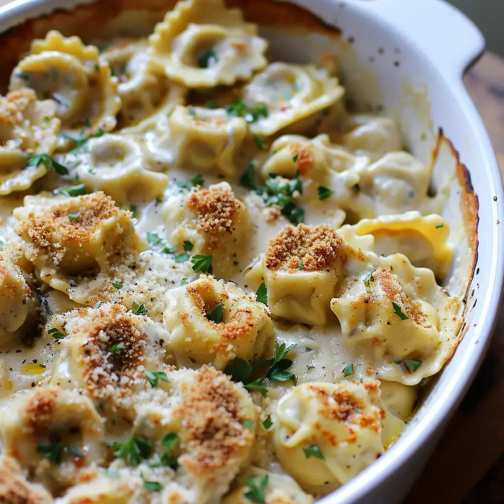 A pasta bake dish with creamy sauce topped with breadcrumbs and parsley.